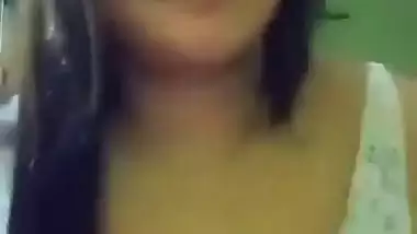 Cute girl opens bra to show sexy boobs to lover