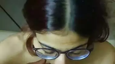 Indian bikini girl in glasses gives blowjob to boyfriend