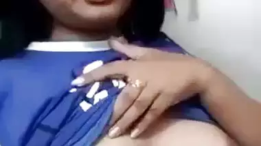 Beautiful desi girl lifting top to reveal sexy boobs