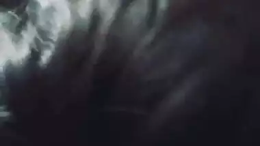 Slim girlfriend smiling while giving handjob and blowjob